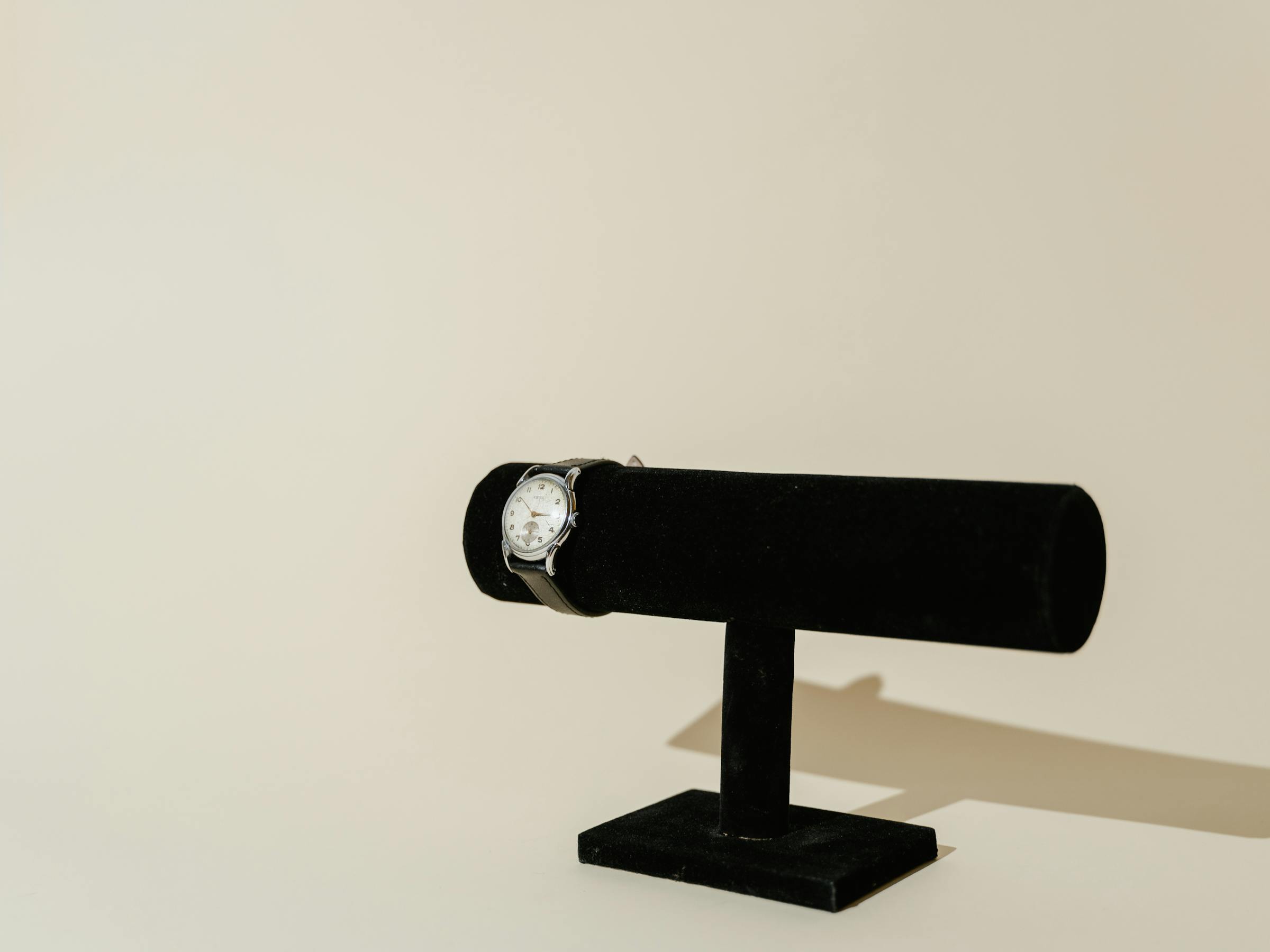 A fine wristwatch presented on a display stand, ready for inspection.